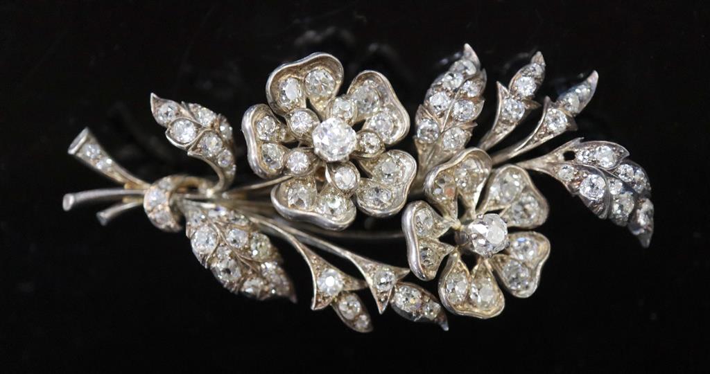 A Victorian gold, silver and graduated old round and cushion cut diamond set trembleuse floral spray brooch,